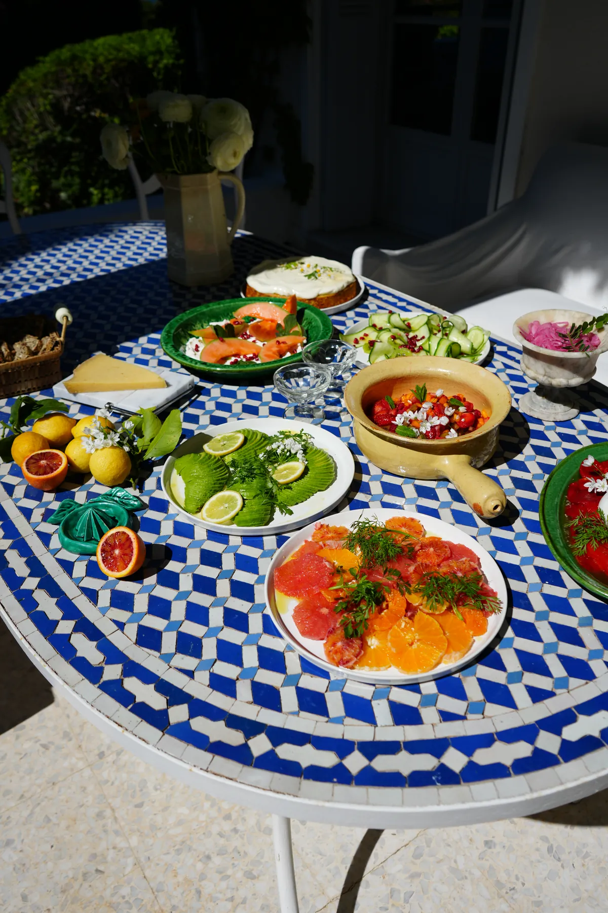 Citrus and avocado on a blue mosaic table
