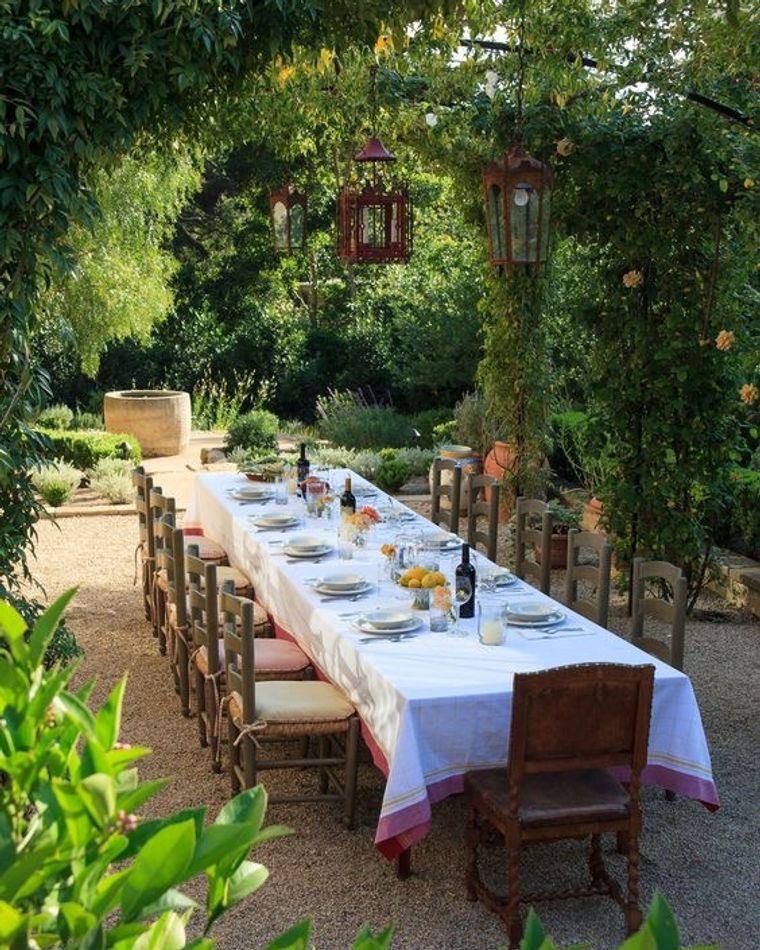A long table laid under the trees