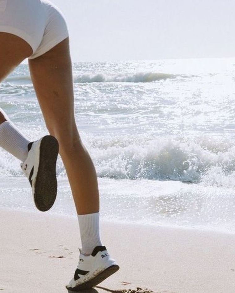A runner on the shoreline